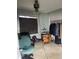 A bedroom featuring a chair and closet space, illuminated by a ceiling fan with integrated lighting at 2071 Liston Ct, Orlando, FL 32811