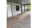 View of a covered carport with access to an exterior storage door and a gated entryway at 2071 Liston Ct, Orlando, FL 32811