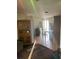 Open dining area with tile flooring, vintage furniture, and a sunlit doorway at 2071 Liston Ct, Orlando, FL 32811