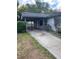 Exterior view of home with a covered carport and driveway at 2071 Liston Ct, Orlando, FL 32811