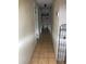 Hallway with tile floors and an open shelving unit at 2071 Liston Ct, Orlando, FL 32811
