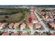 Aerial view showing houses with terracotta tile roofs and private pools in a community setting at 219 Rosso Dr, Davenport, FL 33837