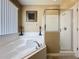 Bright bathroom featuring a soaking tub and glass-enclosed shower with tile surround at 219 Rosso Dr, Davenport, FL 33837