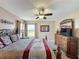 Bedroom with a large window and wooden furniture at 219 Rosso Dr, Davenport, FL 33837