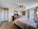 Bedroom featuring a bed, dresser with mirror and window letting in natural light at 219 Rosso Dr, Davenport, FL 33837