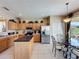 Eat-in kitchen area featuring a glass table and chairs near sliding glass doors with backyard views at 219 Rosso Dr, Davenport, FL 33837
