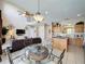 Spacious living area featuring an open floor plan, comfortable seating, and an adjacent dining area at 219 Rosso Dr, Davenport, FL 33837