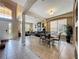 Open-concept living space with neutral colors, tile floors, dining area, and a view of the front door at 219 Rosso Dr, Davenport, FL 33837