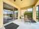 Outdoor patio area with comfortable lounge chairs and sliding door access to the interior at 219 Rosso Dr, Davenport, FL 33837