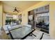 Covered outdoor patio featuring a dining table and chairs, ideal for enjoying meals outdoors at 219 Rosso Dr, Davenport, FL 33837