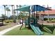 Community playground with a covered slide and climbing structure provides outdoor fun at 219 Rosso Dr, Davenport, FL 33837