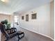 Cozy upstairs sitting area offering plush chairs and carpet at 219 Rosso Dr, Davenport, FL 33837