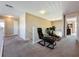 View of the upstairs sitting area, featuring a carpeted floor and natural lighting at 219 Rosso Dr, Davenport, FL 33837