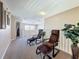 Upstairs sitting area boasts comfortable lounge chairs and lots of natural light at 219 Rosso Dr, Davenport, FL 33837