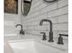 Bathroom features a dual sink with modern faucet fixtures and stylish subway tile backsplash at 2287 Park Maitland Ct, Maitland, FL 32751