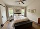 Comfortable bedroom with natural light, stylish furnishings, and hardwood floors at 2287 Park Maitland Ct, Maitland, FL 32751