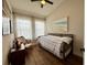 Bedroom with bright windows, wood floors, complemented by natural light and airy curtains at 2287 Park Maitland Ct, Maitland, FL 32751