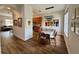 Elegant dining area featuring wood floors, a modern light fixture, and abundant natural light at 2287 Park Maitland Ct, Maitland, FL 32751
