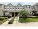 Charming townhome featuring manicured landscaping, stone accents, and a welcoming front entrance at 2287 Park Maitland Ct, Maitland, FL 32751