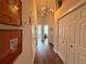 Bright hallway features contemporary lighting, wood floors and convenient closet space at 2287 Park Maitland Ct, Maitland, FL 32751