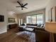 Spacious living room featuring a large sectional sofa, hardwood floors, and a bright, airy atmosphere at 2287 Park Maitland Ct, Maitland, FL 32751