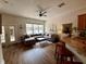 Cozy living area with hardwood floors, a comfortable sectional sofa, and lots of natural light at 2287 Park Maitland Ct, Maitland, FL 32751