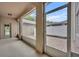 This is a view of a tiled patio with white fencing from underneath a covered porch at 2287 Park Maitland Ct, Maitland, FL 32751