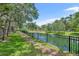 Community walking path alongside a pond at 2287 Park Maitland Ct, Maitland, FL 32751