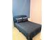 Comfortable bedroom with a well-made bed, blue headboard, and contrasting blue and pink wall at 2386 Rama Dr, Kissimmee, FL 34746