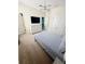 Cozy bedroom with a striped bedspread, white dresser, and two doors to other rooms at 2386 Rama Dr, Kissimmee, FL 34746