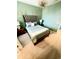 Stylish bedroom with elegant bed, carpet, decorative lighting, and unique wall decor at 2386 Rama Dr, Kissimmee, FL 34746