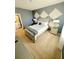 Comfortable bedroom featuring carpet, a queen bed, bedside tables, and a window with natural light at 2386 Rama Dr, Kissimmee, FL 34746