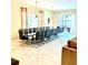 Dining room features a long table with seating for fourteen and decorative lighting at 2386 Rama Dr, Kissimmee, FL 34746
