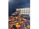 Finished garage with colorful flooring, basketball game, and foosball table at 2386 Rama Dr, Kissimmee, FL 34746