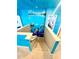 A staircase and blue hallway with a Finding Nemo themed mural at 2386 Rama Dr, Kissimmee, FL 34746