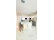 Bright kitchen featuring white cabinets, stainless steel appliances, quartz countertops and a large island at 2386 Rama Dr, Kissimmee, FL 34746