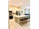 Modern kitchen with an island, stainless steel appliances, and marble floors at 2386 Rama Dr, Kissimmee, FL 34746