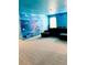 Whimsical recreation room with custom underwater murals, and a comfortable sectional sofa, great for Gathering fun at 2386 Rama Dr, Kissimmee, FL 34746