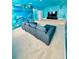 Unique living room showcasing a whimsical underwater theme, complete with custom wall murals and comfortable seating at 2386 Rama Dr, Kissimmee, FL 34746