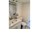 Bright bathroom featuring a marble vanity top and modern fixtures at 265 E Canton Ave # Ge, Winter Park, FL 32789