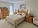 Serene bedroom with natural wood furniture and cozy bedding at 265 E Canton Ave # Ge, Winter Park, FL 32789