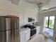 Well-lit kitchen features stainless steel appliances and ample counter space at 265 E Canton Ave # Ge, Winter Park, FL 32789