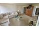 Comfortable living area with plush sofa, glass coffee table, and neutral decor at 265 E Canton Ave # Ge, Winter Park, FL 32789