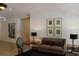 Inviting living room showcasing a sofa, chair, end tables, and artwork at 265 E Canton Ave # Ge, Winter Park, FL 32789