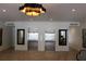 Elegant lobby area with elevators, modern lighting, and decorative mirrors with neutral tile flooring at 265 E Canton Ave # Ge, Winter Park, FL 32789
