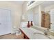 Bathroom with double sink vanity, tiled floor, a large mirror, and a glass shower stall at 2736 Oakwater Dr, Kissimmee, FL 34747
