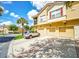 Two-story townhome with multi-car garages, quaint shutters, and balcony in a landscaped neighborhood at 2736 Oakwater Dr, Kissimmee, FL 34747