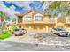 Inviting two-story townhome with attached garages and parking, set in a sunny, well-kept community at 2736 Oakwater Dr, Kissimmee, FL 34747