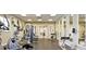 Community gym featuring modern exercise equipment and mirrored walls at 2736 Oakwater Dr, Kissimmee, FL 34747
