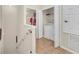 Laundry area with white washer and dryer, tile floors, and additional storage shelves at 2736 Oakwater Dr, Kissimmee, FL 34747